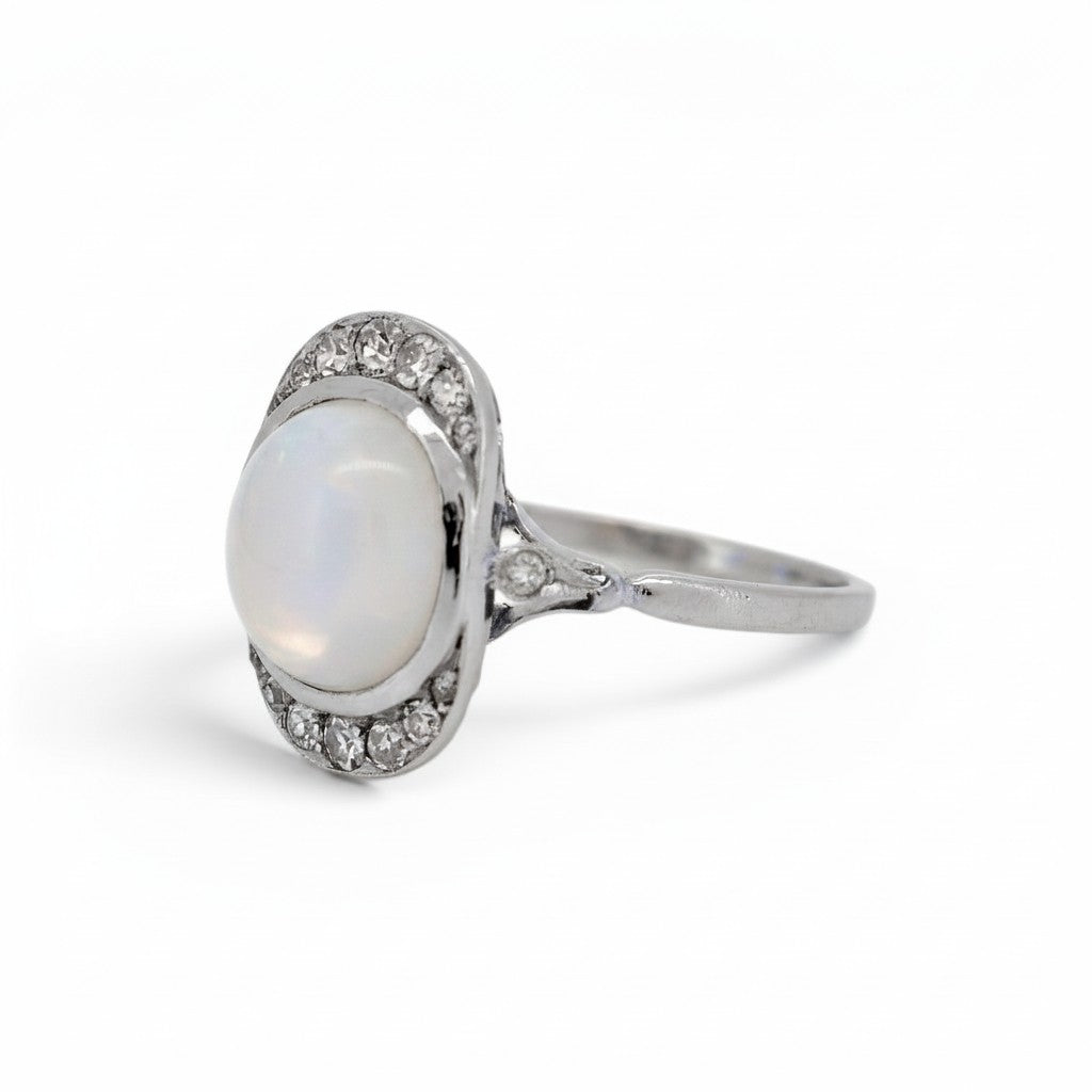 Natural moonstone cabochon approximately 3 carats adularescence Art Deco ring close-up — Antique Jewelry Finds