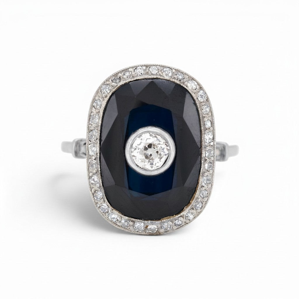 Antique Art Deco platinum cocktail ring 
natural sapphire 10-15ct old-cut diamond halo front view circa 1920 — Antique Jewelry Finds