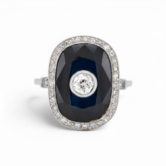 Antique Art Deco platinum cocktail ring 
natural sapphire 10-15ct old-cut diamond halo front view circa 1920 — Antique Jewelry Finds