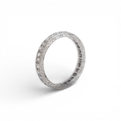 Detailed macro shot of D/E/F color colorless diamonds on an antique platinum band