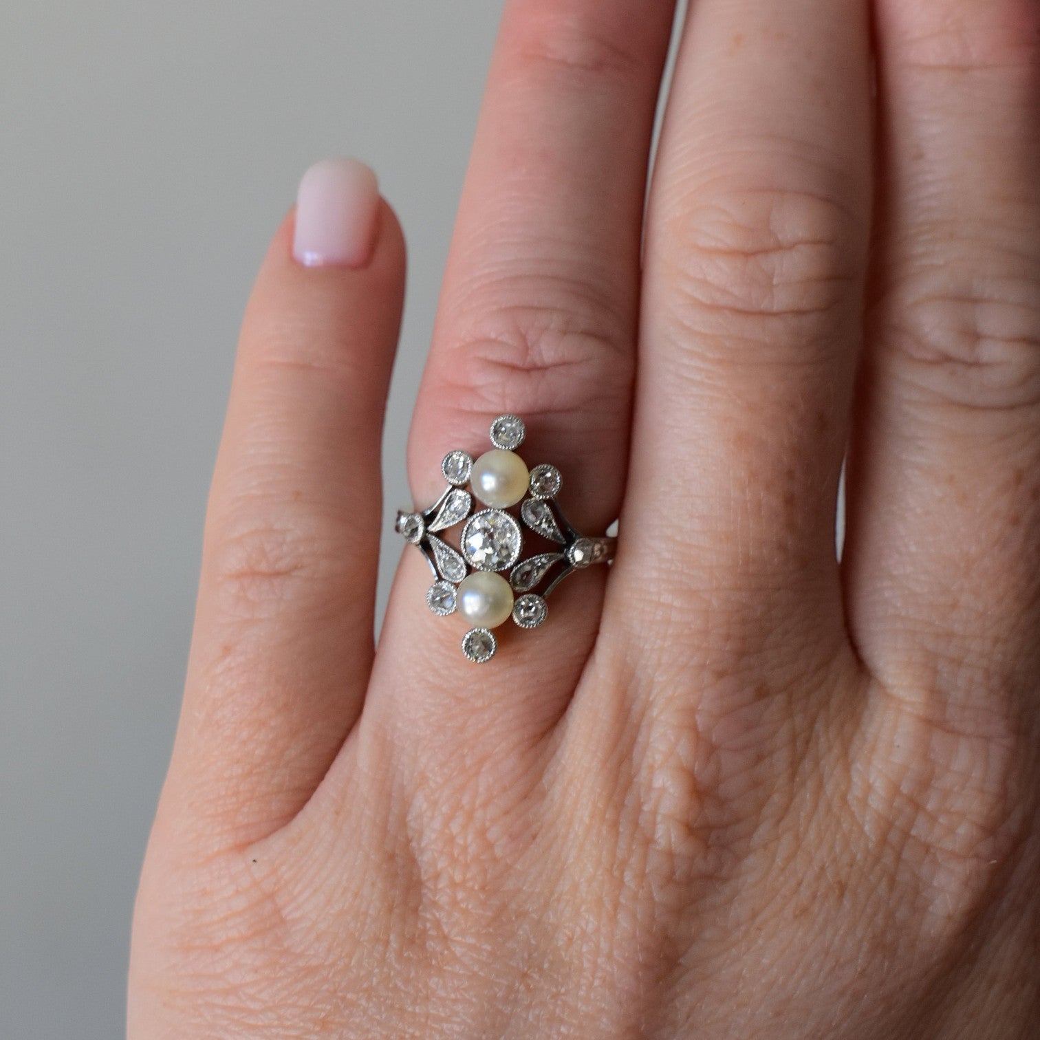 Two matched pearls 5mm old-cut diamond 0.30ct Art Nouveau ring close-up circa 1910 — Antique Jewelry Finds