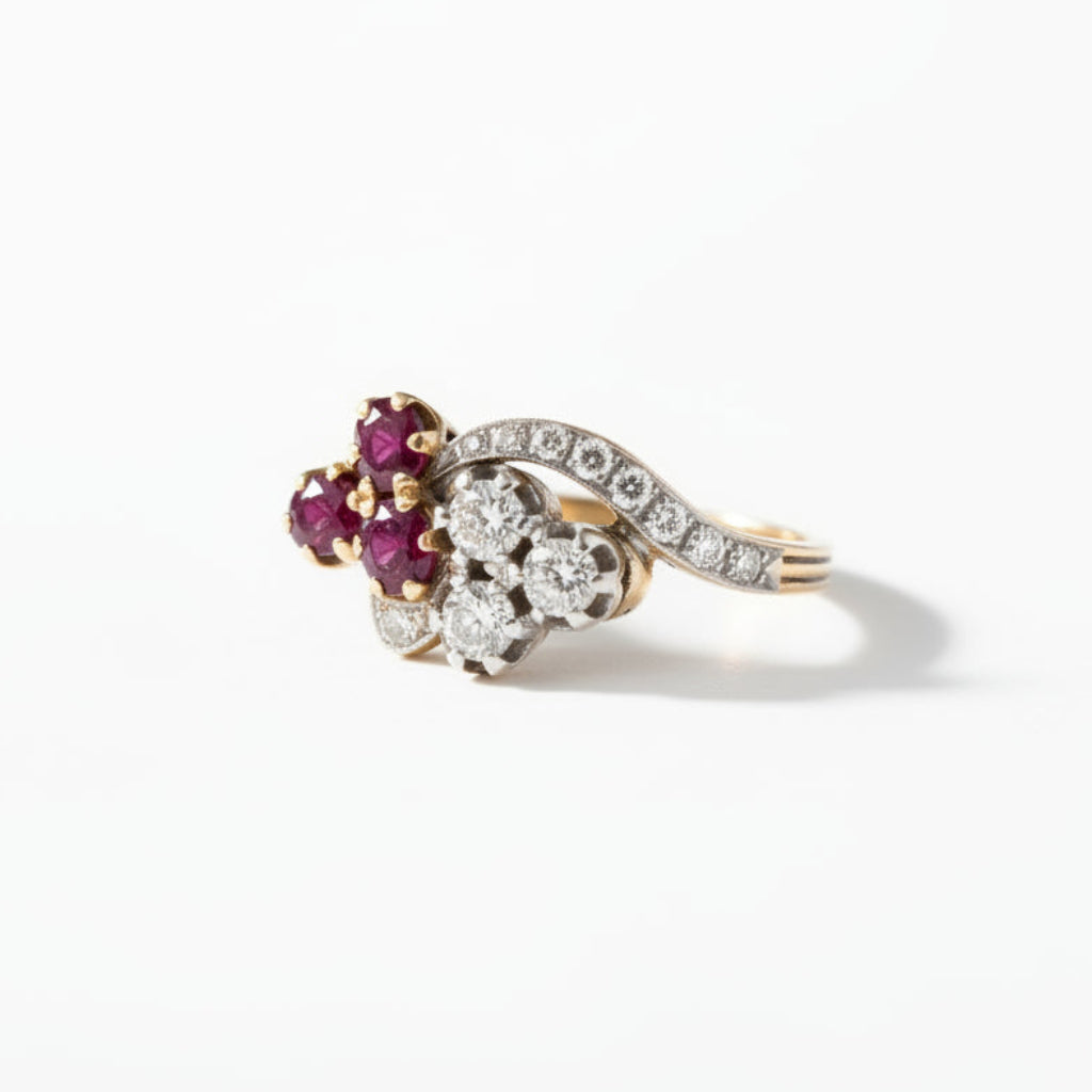 Other side angle of 11.5mm wide antique ruby and diamond clover ring showing the stylized stem band