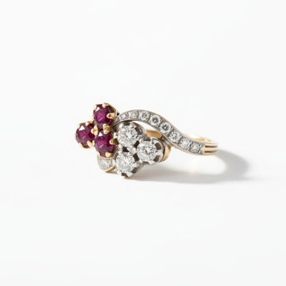 Other side angle of 11.5mm wide antique ruby and diamond clover ring showing the stylized stem band