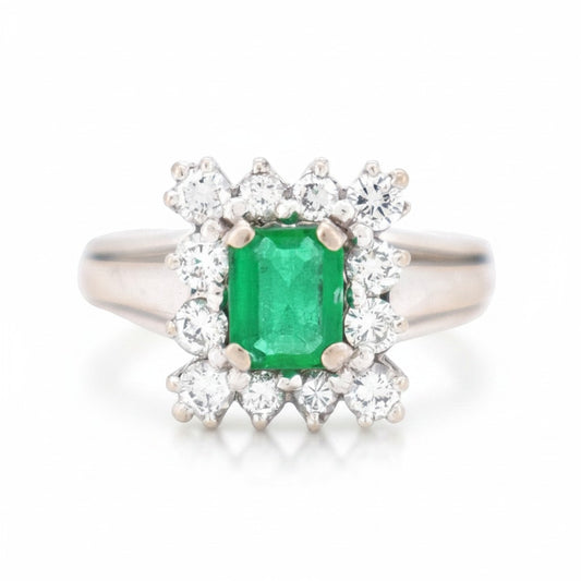 Vintage 1970s 14k white gold halo ring with natural step-cut emerald and 12 diamonds