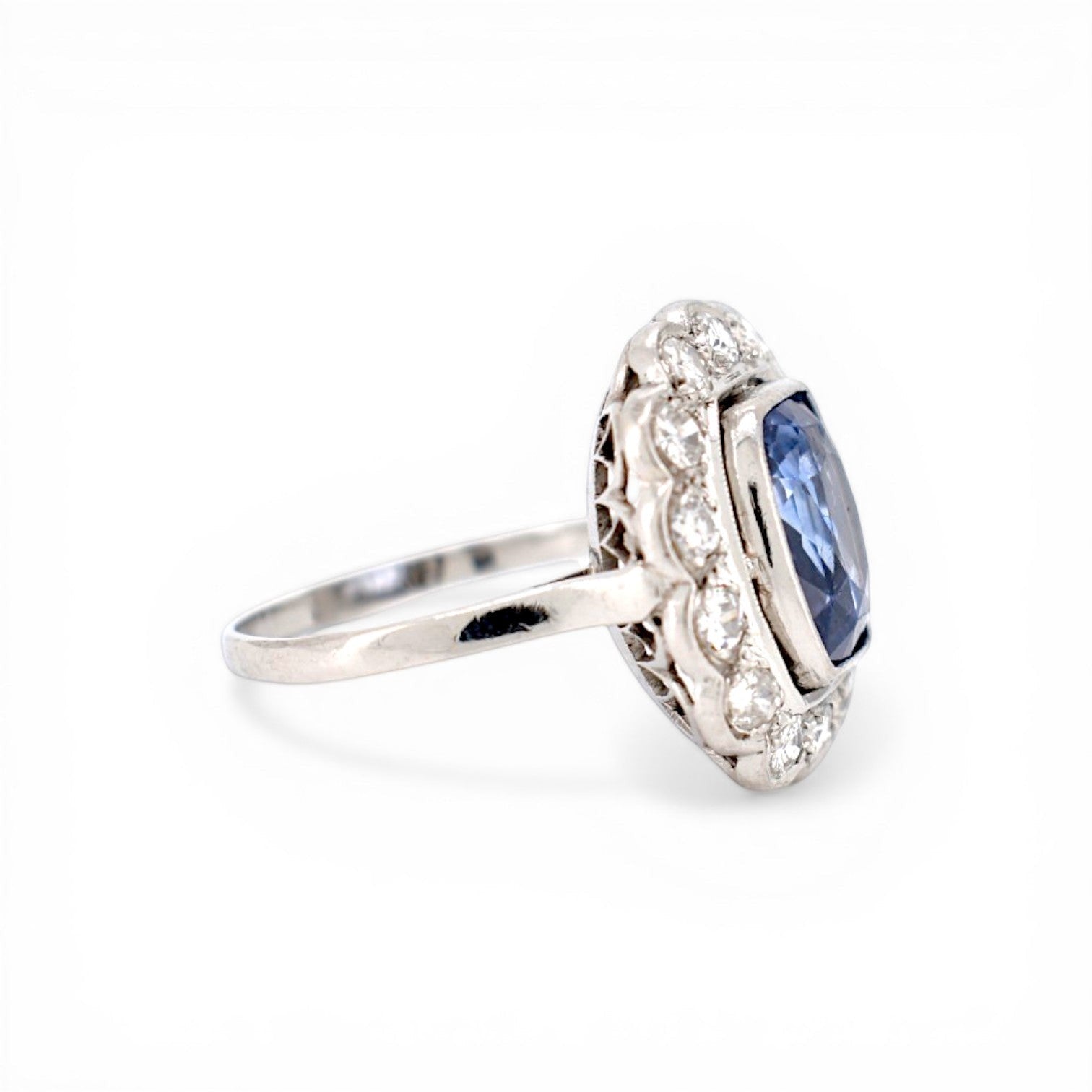 Detailed shot of 1.20ct G/H color diamond halo surrounding unheated sapphire