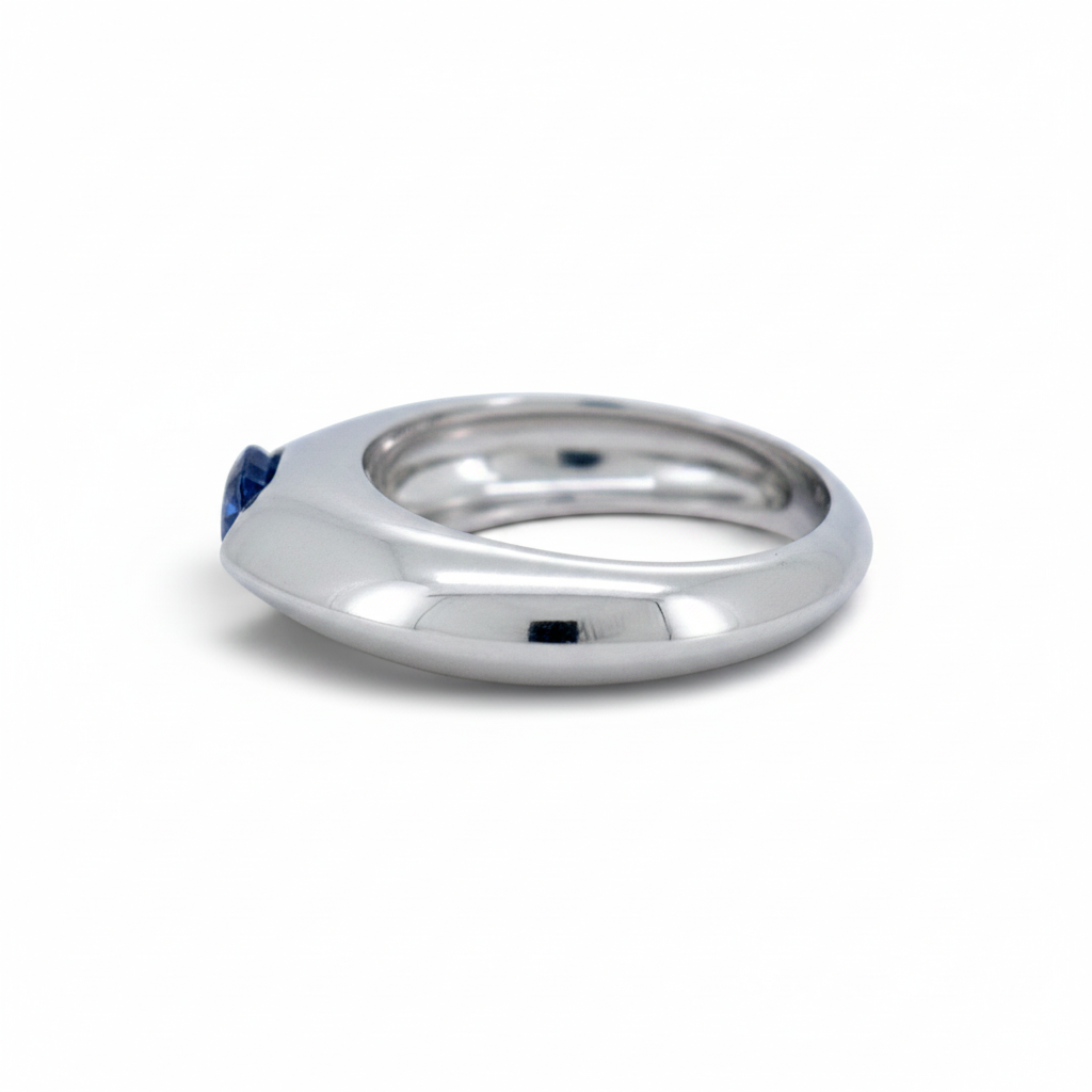 Antique Jewelry Finds Piaget Biseau 18k gold ring featuring a natural sapphire and brilliant-cut diamond.