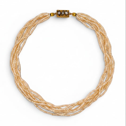 Complete overhead view of the 41 cm antique multi-strand pearl necklace showing the perfect symmetry of the six rows.