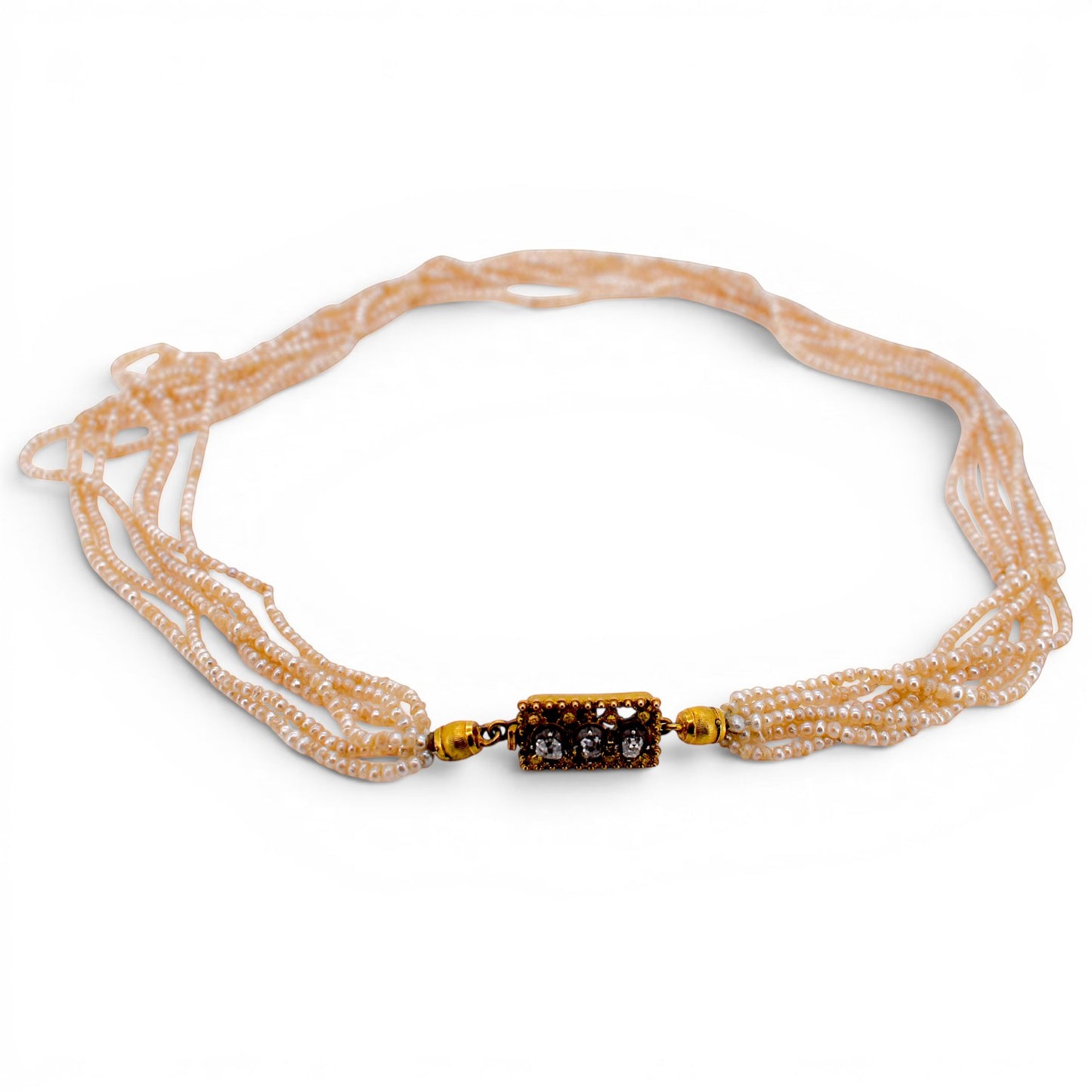 Complete otherview of overhead view of the 41 cm antique multi-strand pearl necklace showing the perfect symmetry of the six rows.