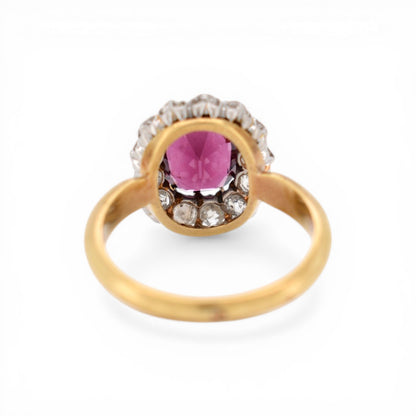 Detail of 1 carat old European cut diamonds surrounding a central garnet stone