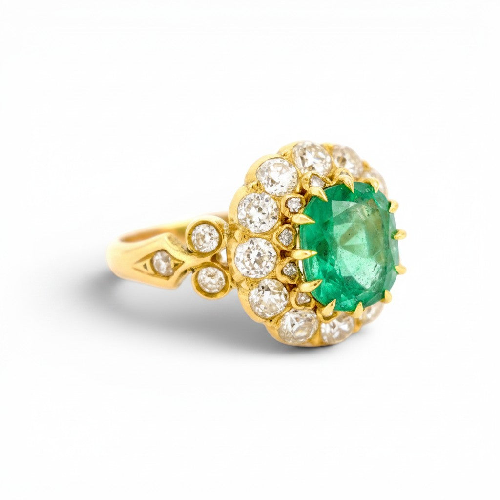 Detailed macro view of the two-tier crown setting featuring antique rose-cut diamonds surrounding the central Zambian emerald.