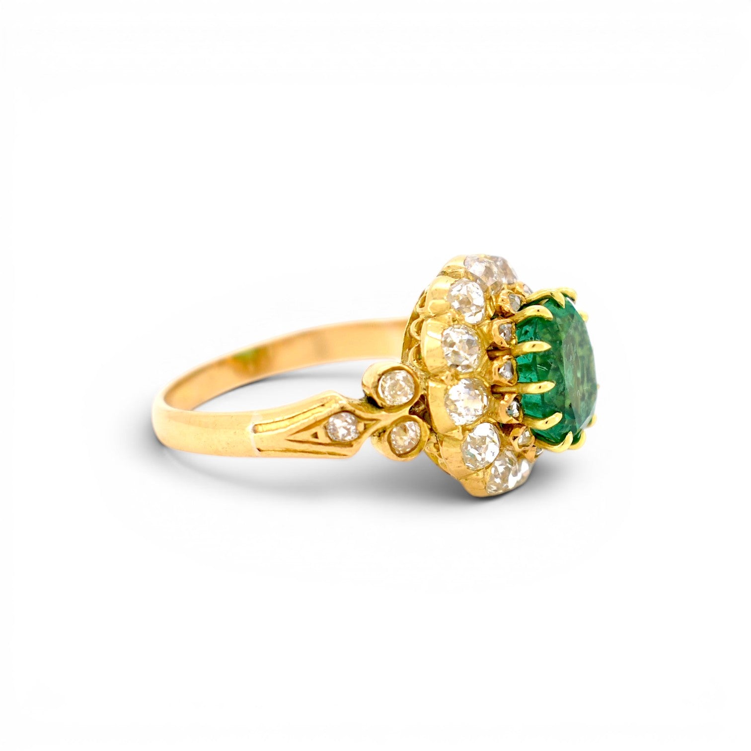 Side profile of the 1880 Napoleon III emerald statement ring showing the elevation of the double halo gallery and polished band.