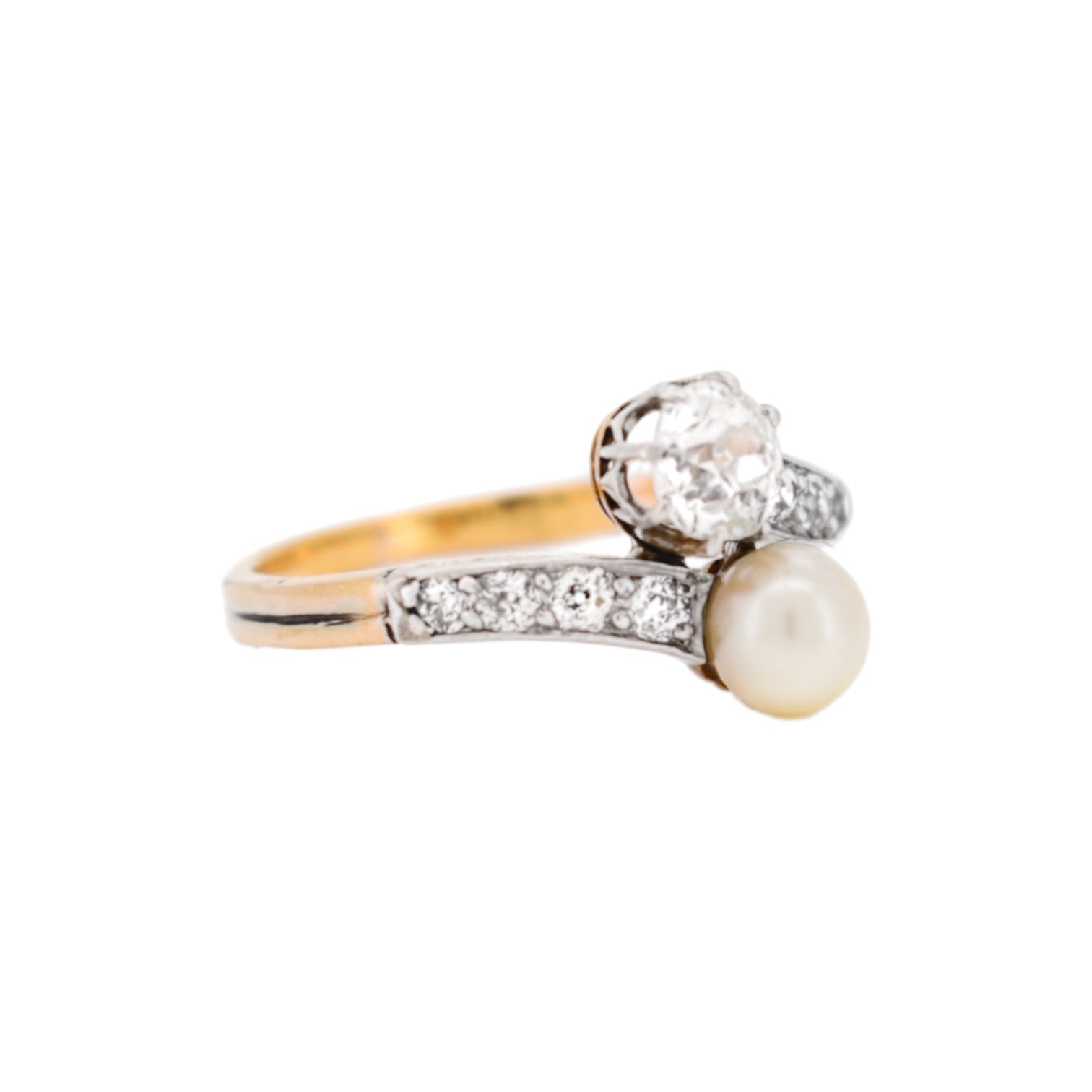 Detailed view of a 5mm cream pearl on a 1900s antique bypass ring