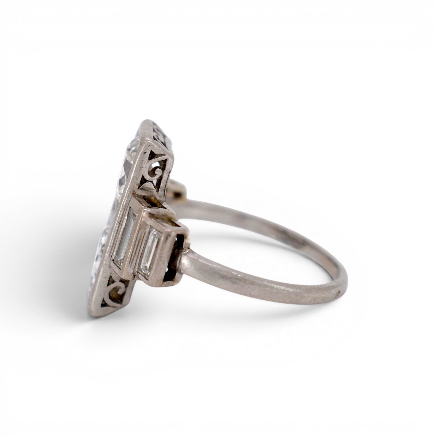 Side profile of the 15mm vertical Toi et Moi diamond ring showing the solid platinum setting structure and gallery.