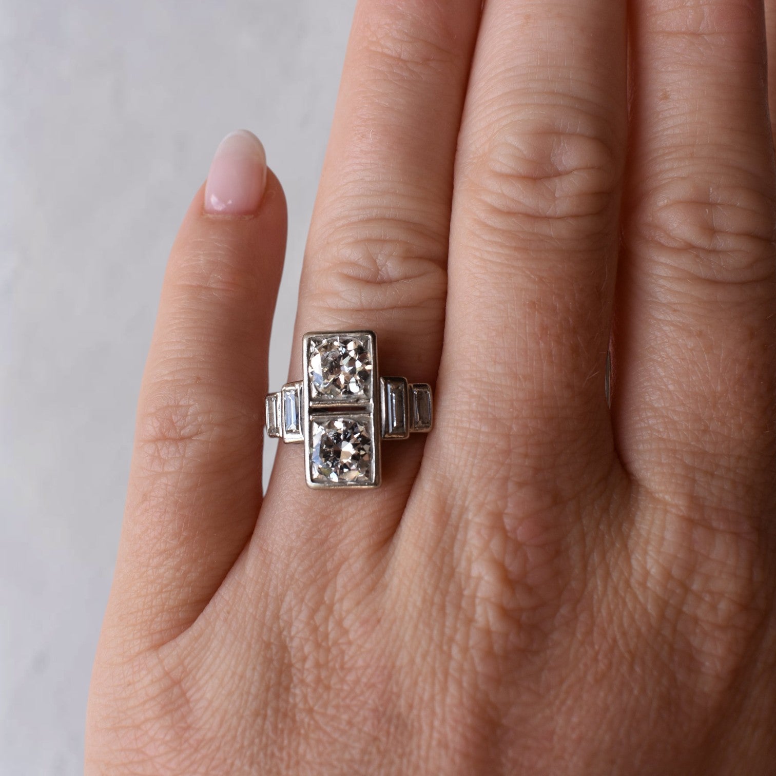 Extreme close-up shot of the hand wearing the 15mm wide old-cut diamond ring, showcasing its scale, finger coverage, and sparkle.