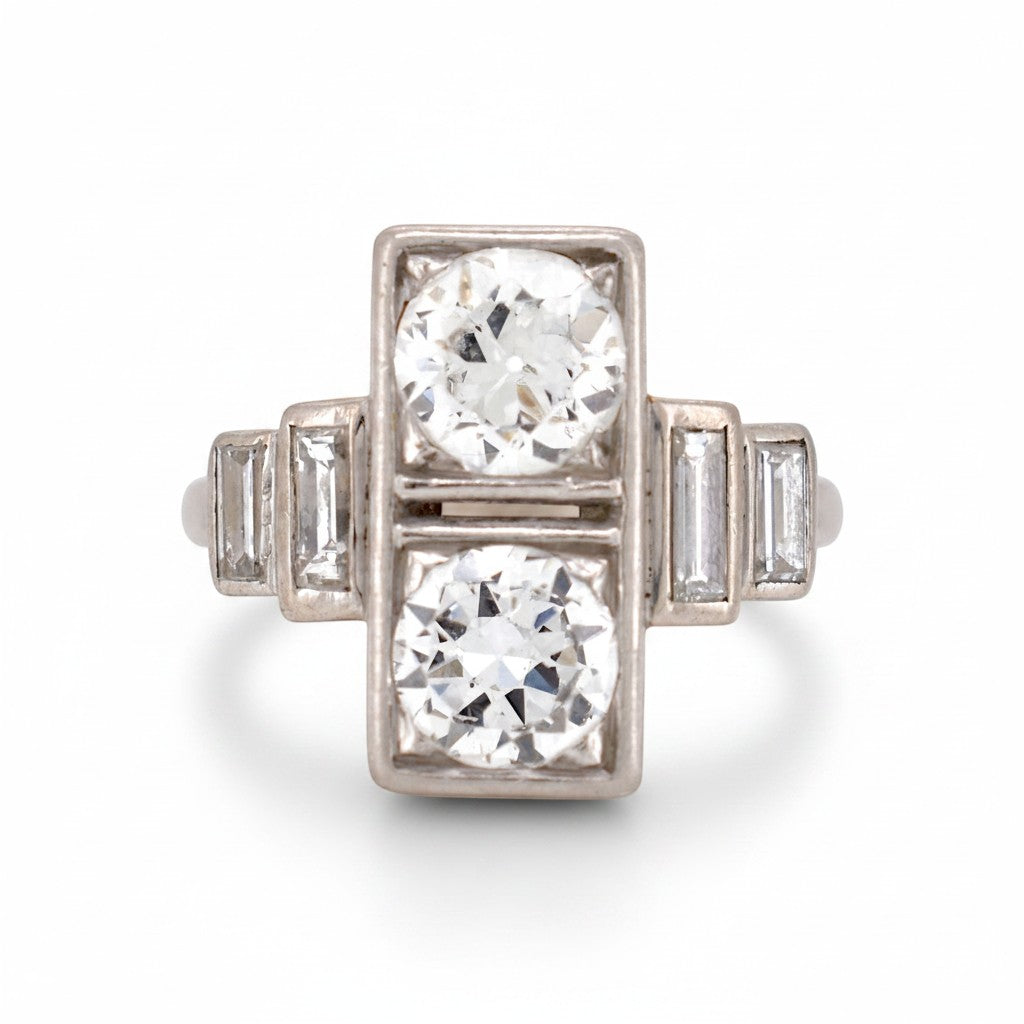 Antique 1920 Art Deco platinum Toi et Moi ring featuring two vertical 1ct old-cut diamonds by Antique Jewelry Finds.