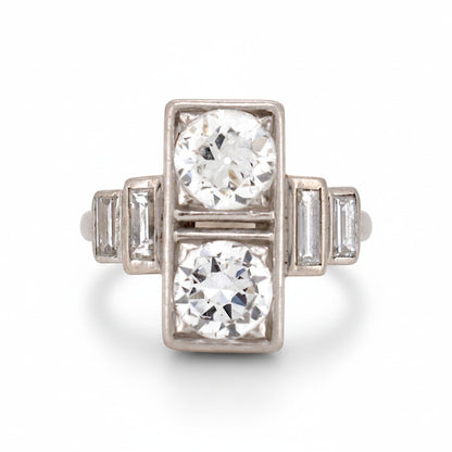 Antique 1920 Art Deco platinum Toi et Moi ring featuring two vertical 1ct old-cut diamonds by Antique Jewelry Finds.