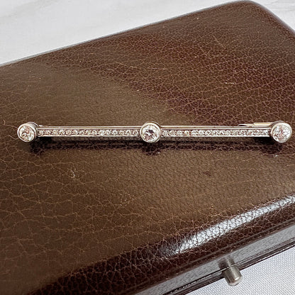 Trio of Old European cut diamonds on a 62mm antique platinum bar brooch
