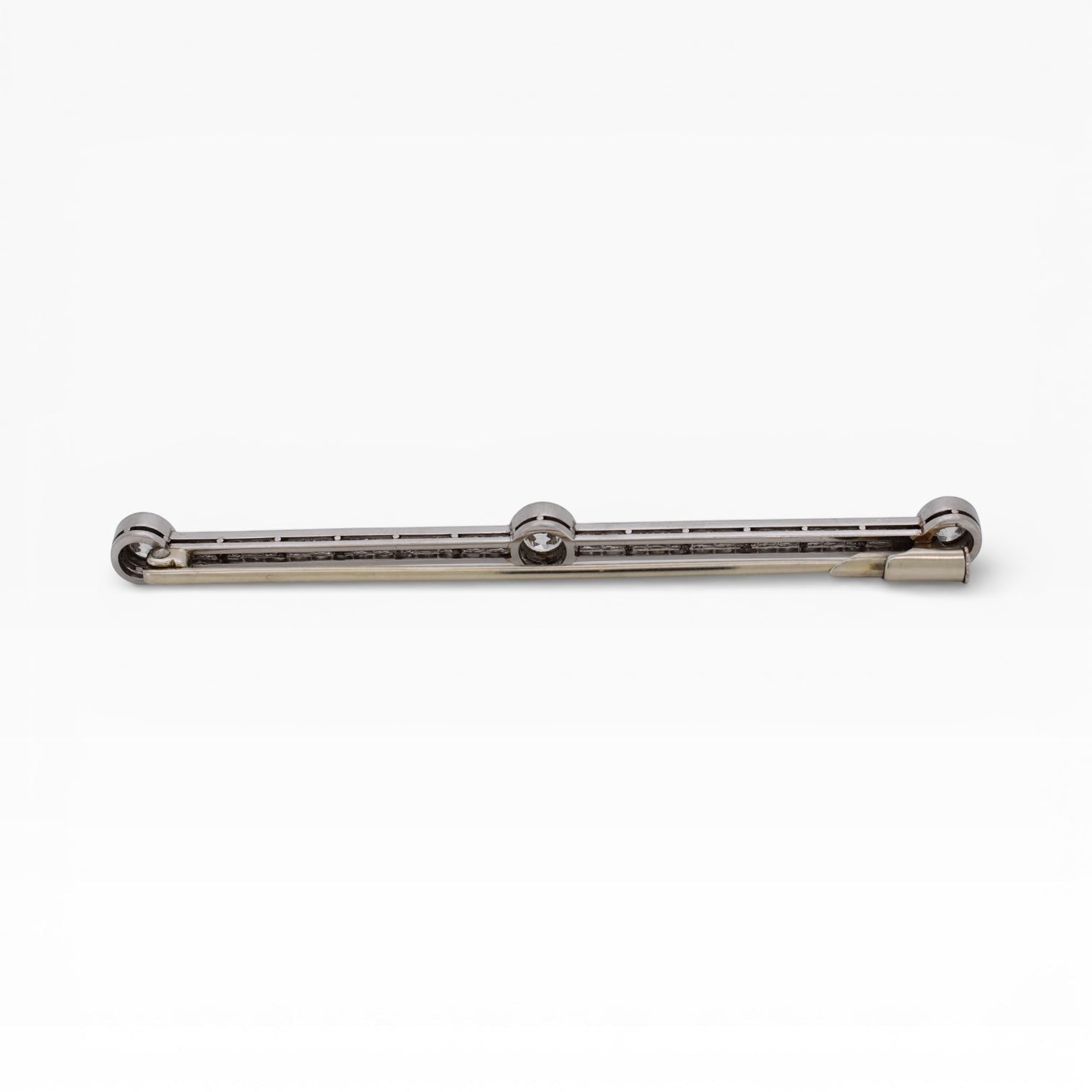 Secure antique safety clasp on the back of a platinum and gold bar brooch