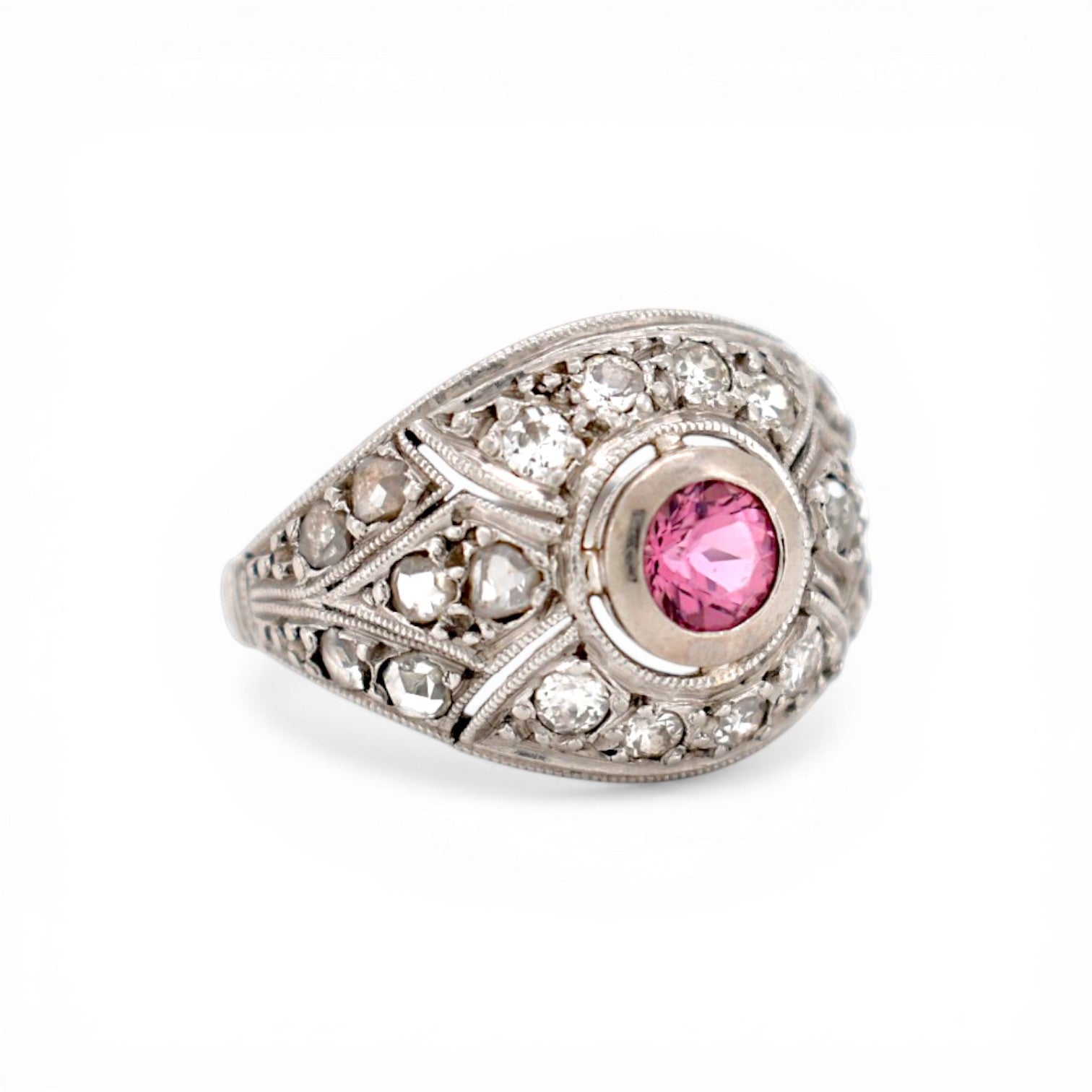 Close-up of 0.3ct pink tourmaline set in Art Deco platinum geometric gallery