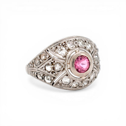Close-up of 0.3ct pink tourmaline set in Art Deco platinum geometric gallery