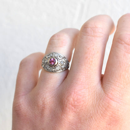 Antique Art Deco pink tourmaline and diamond ring worn on a woman's hand