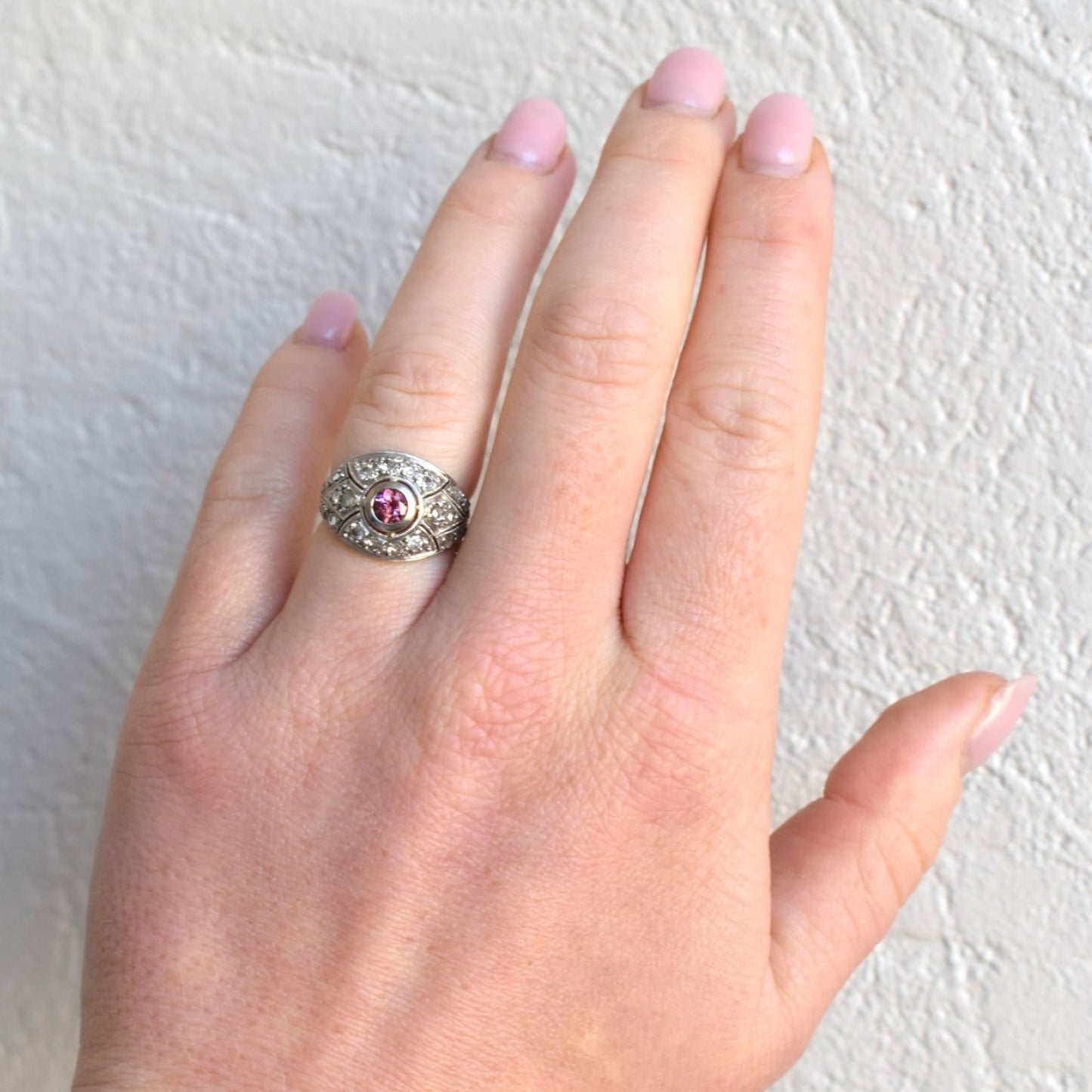 Art deco ring worn by a feminine hand