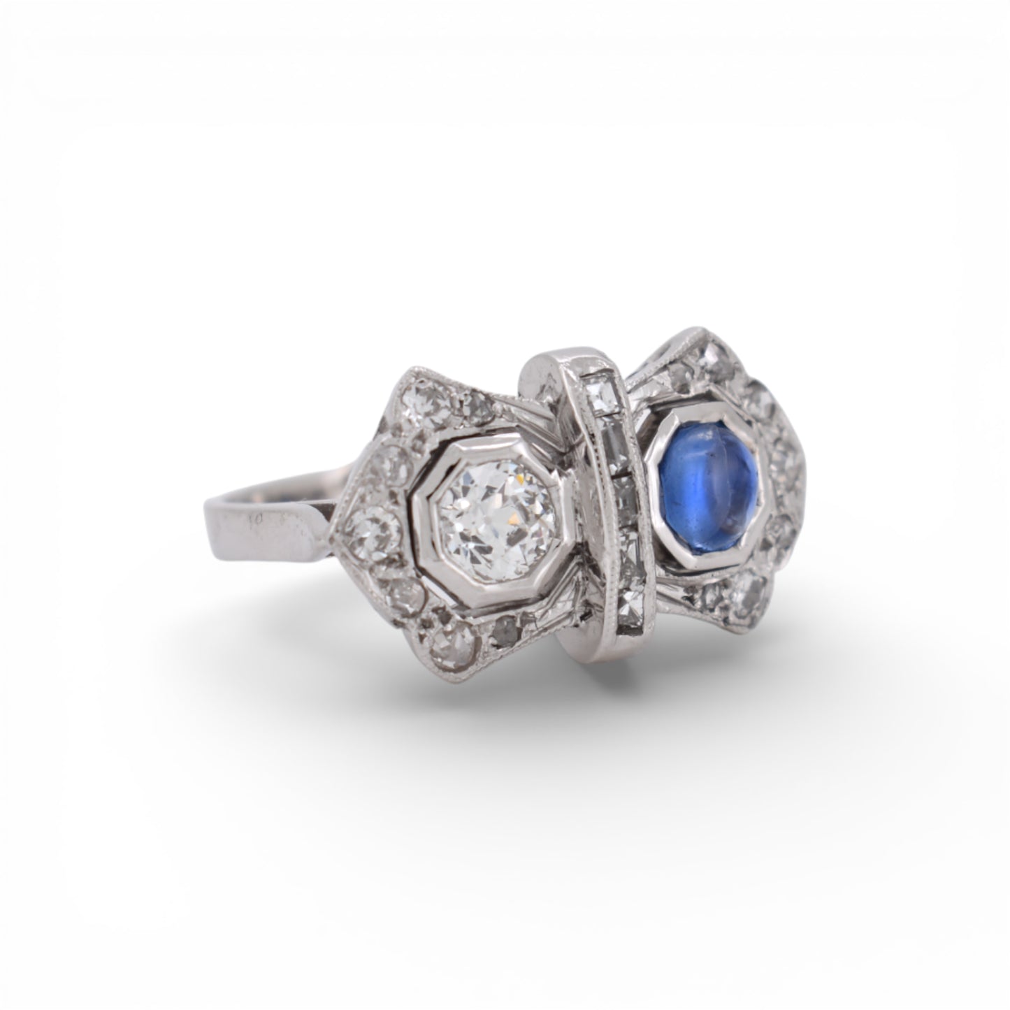 Side profile view of the intricate 18K white gold setting on a 1920s Toi et Moi ring.