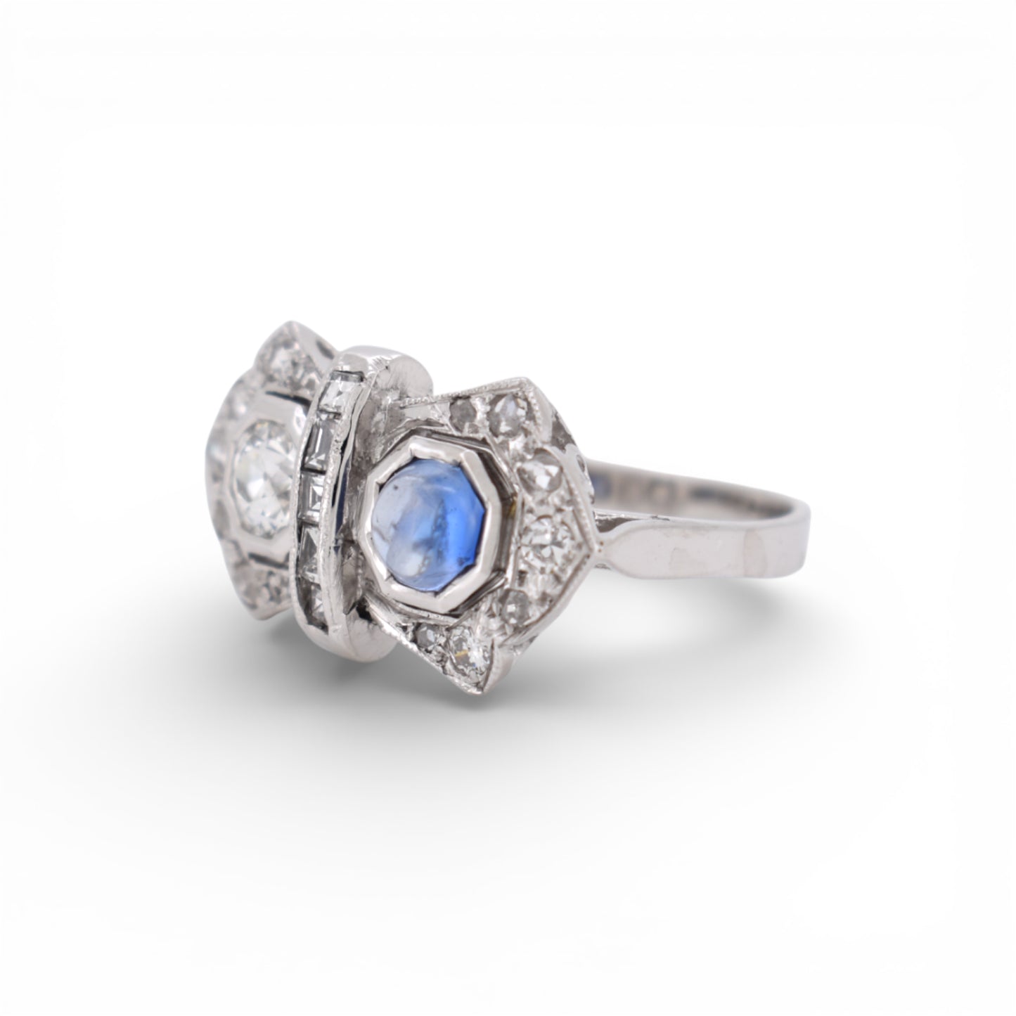 Close-up of the 0.30 carat deep blue sapphire on a vintage French jewelry piece.