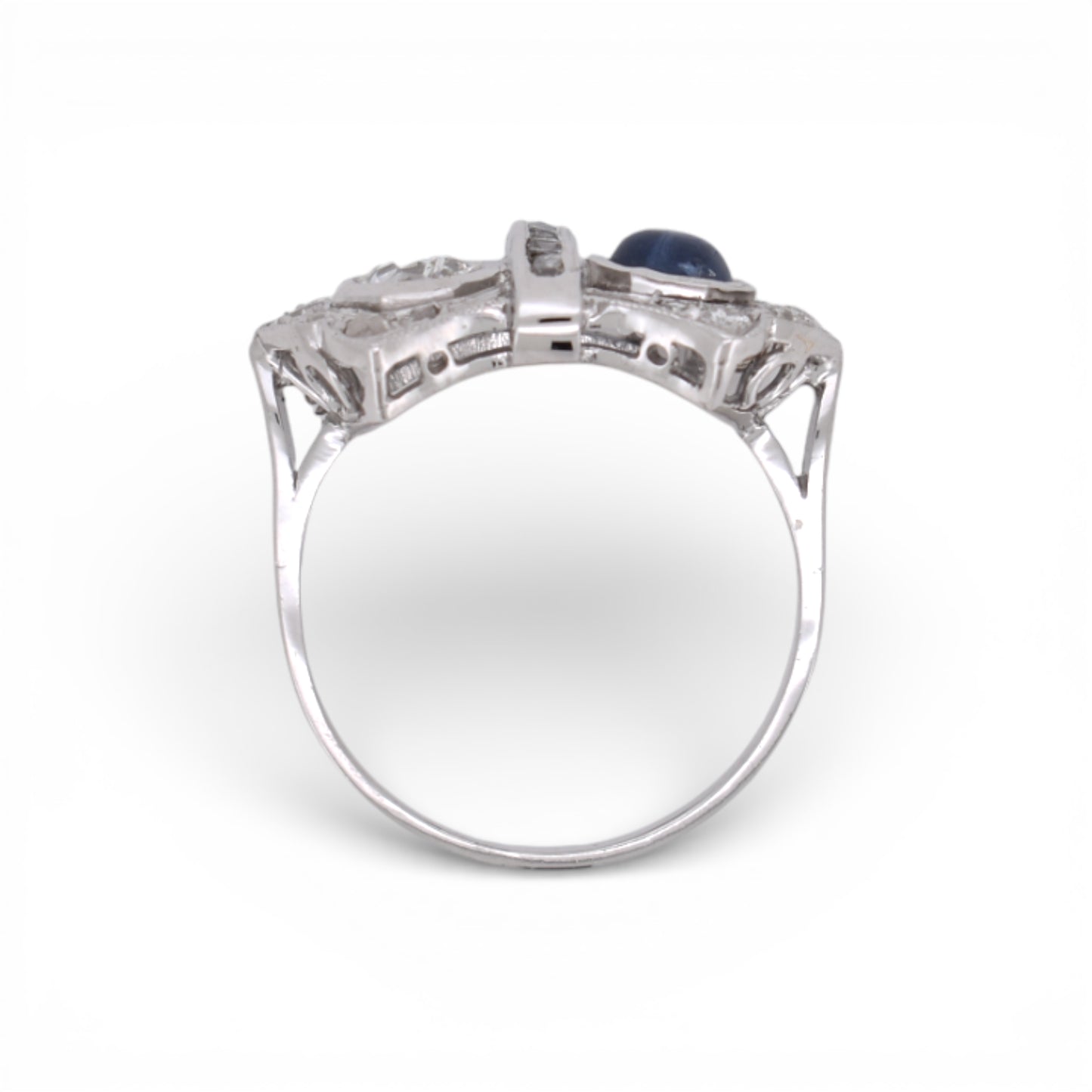 Angled view highlighting the geometric Art Deco design of a sapphire and diamond double-stone ring.