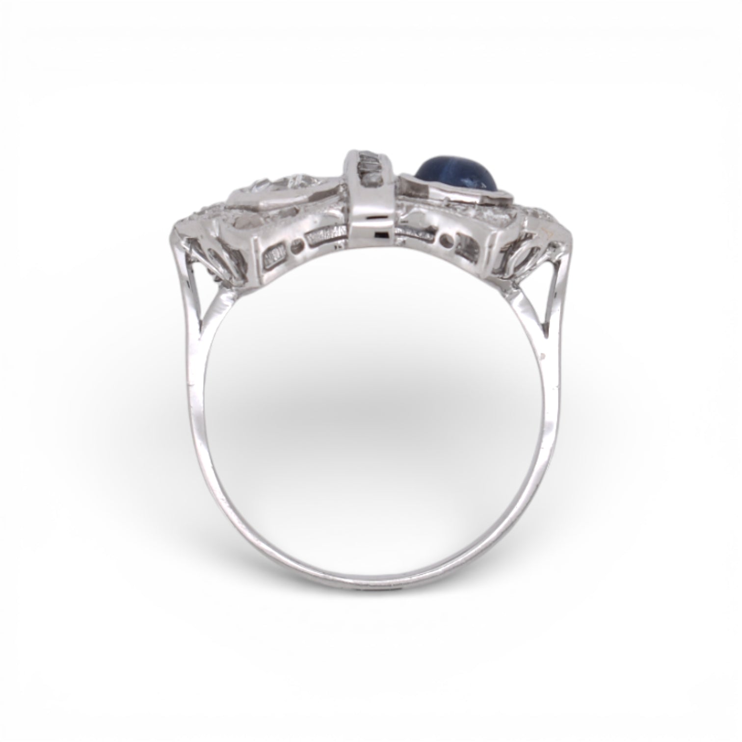 Angled view highlighting the geometric Art Deco design of a sapphire and diamond double-stone ring.