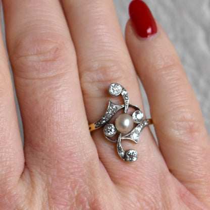 Detailed view of a 5.3mm lustrous pearl on an antique Art Nouveau gold ring