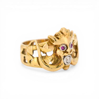 Detailed view of hand-carved ivy leaves on 18k gold ring band