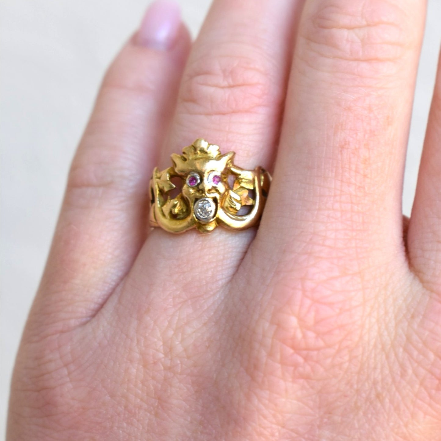 Antique Art Nouveau chimera ring worn on hand 18k gold collector piece, rubies eyes and diamond mouth
