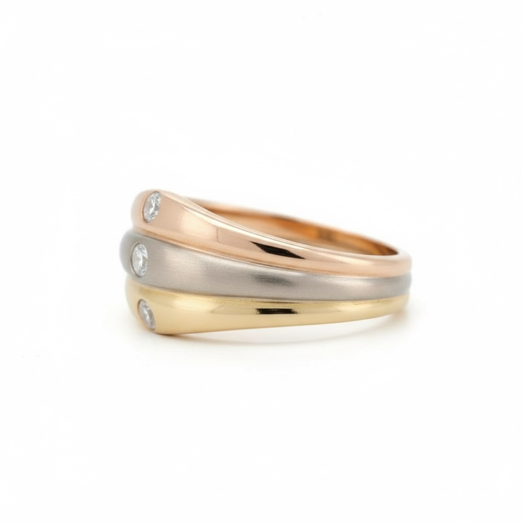 Close-up of yellow, white, and rose gold bands on a Cartier diamond ring