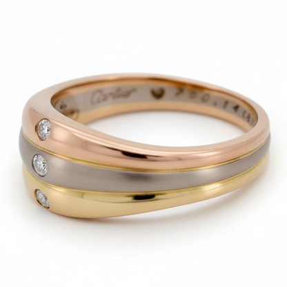 Macro shot of Cartier signature, serial number, and 750 hallmark inside the band