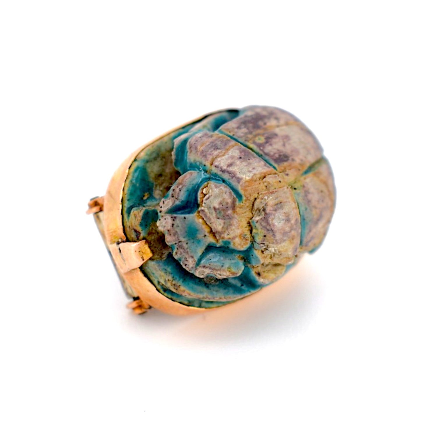 Detailed view of the enameled wood texture and ancient patina of the scarab beetle