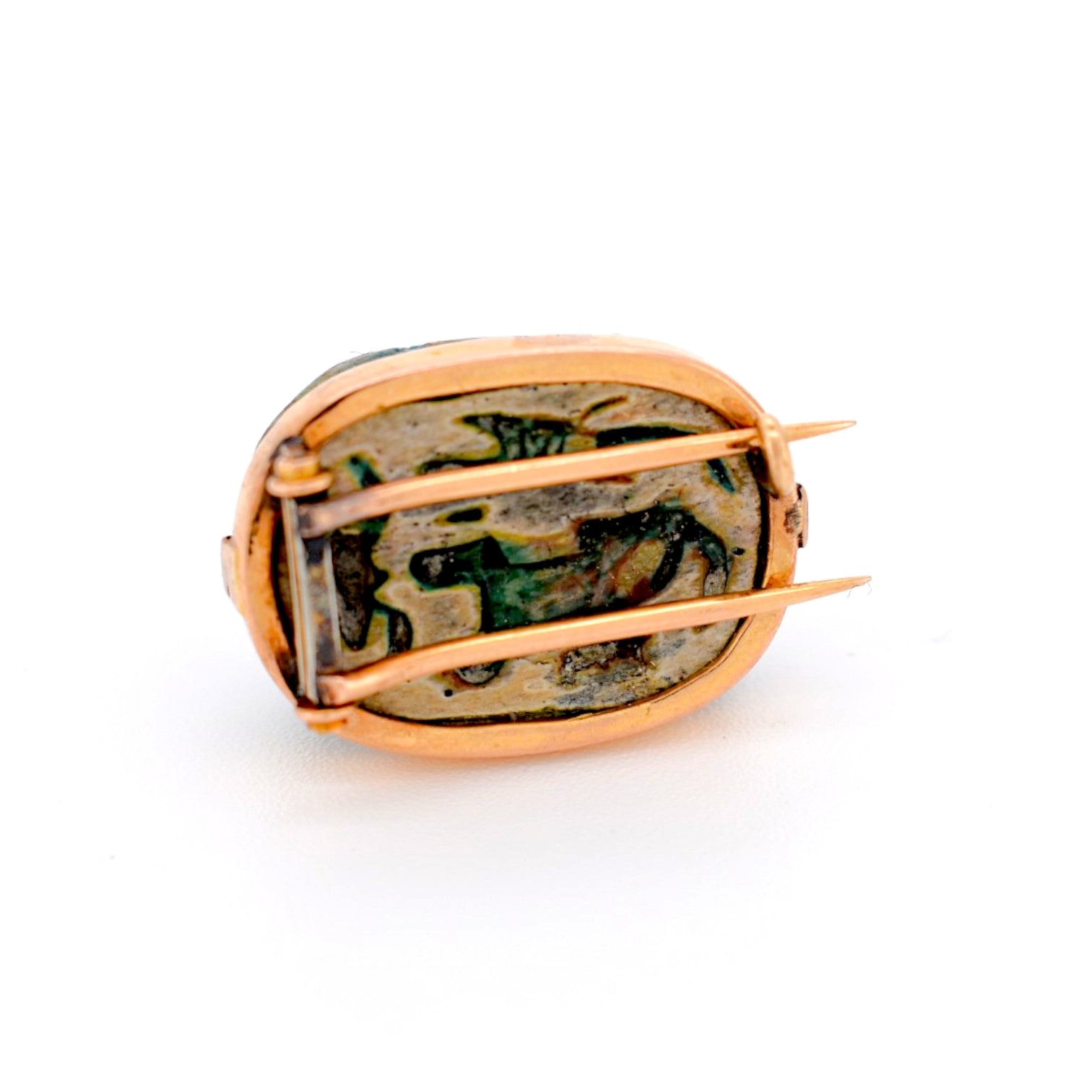 Close-up of original Ancient Egyptian hieroglyphs carved on the back of the scarab