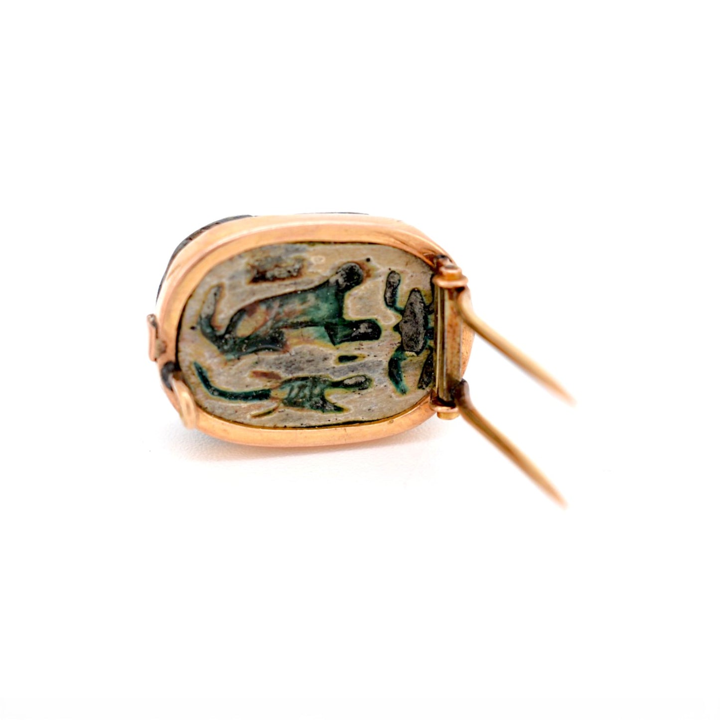 Gold brooch pin and safety mechanism on the back of the Egyptian amulet