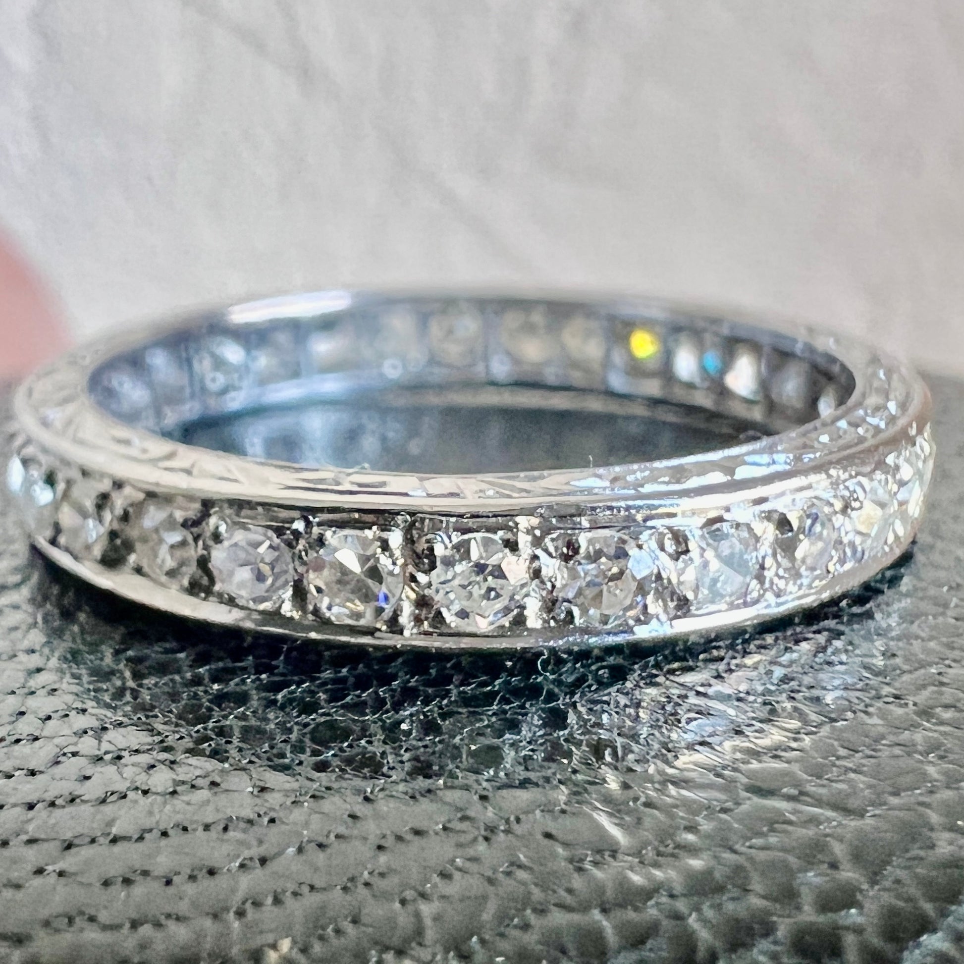 Three-quarter shot showcasing the intense fire and white brilliance of the Art Deco diamonds
