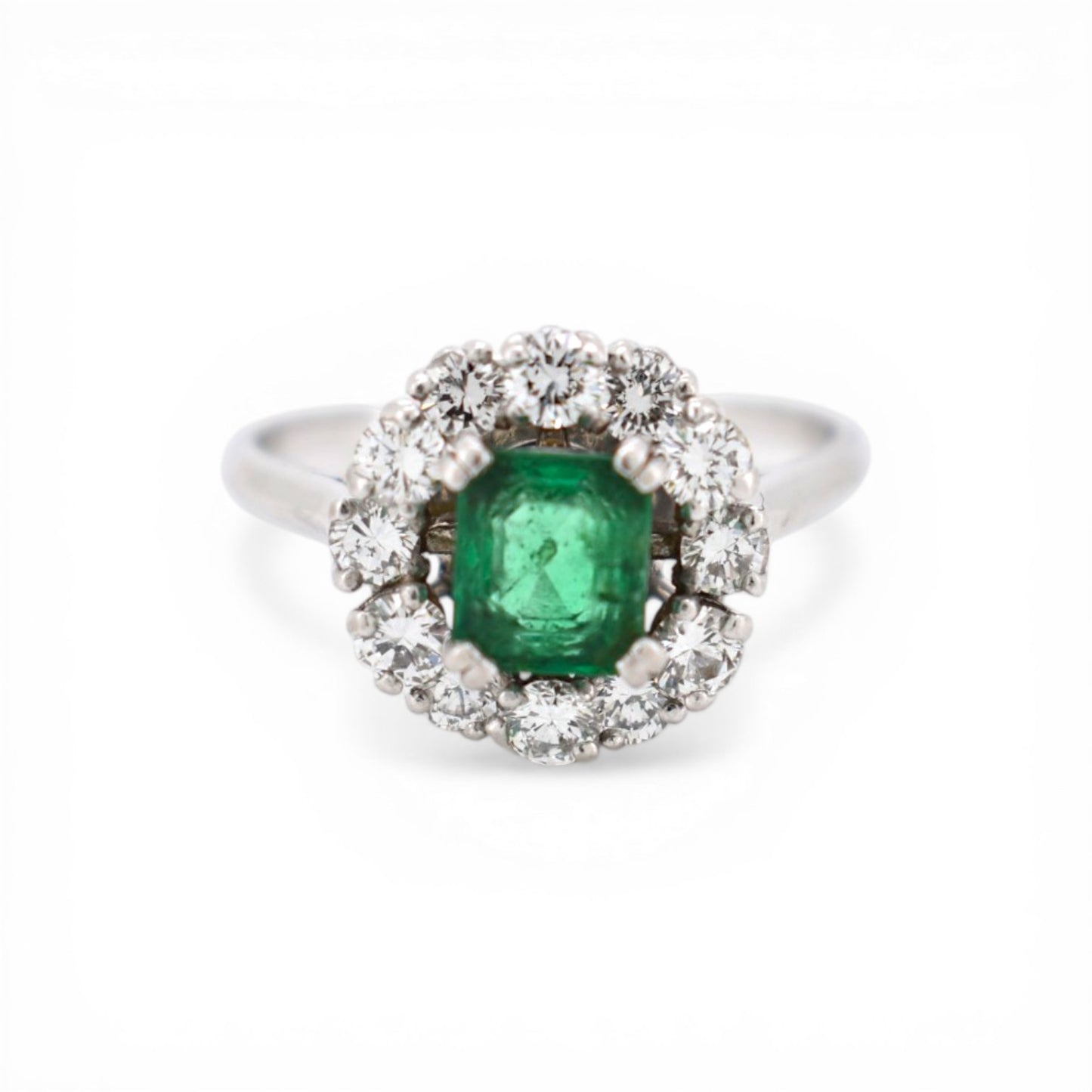Signed Mellerio platinum Marguerite ring with natural emerald and diamond halo