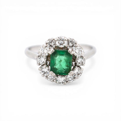 Signed Mellerio platinum Marguerite ring with natural emerald and diamond halo