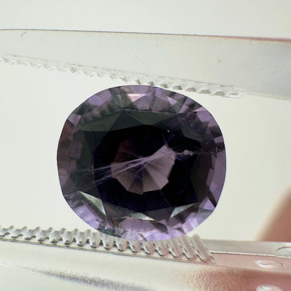 Extreme close-up shot of the 2.10ct unheated Vietnam purple spinel showcasing its crisp cushion facets and natural clarity.