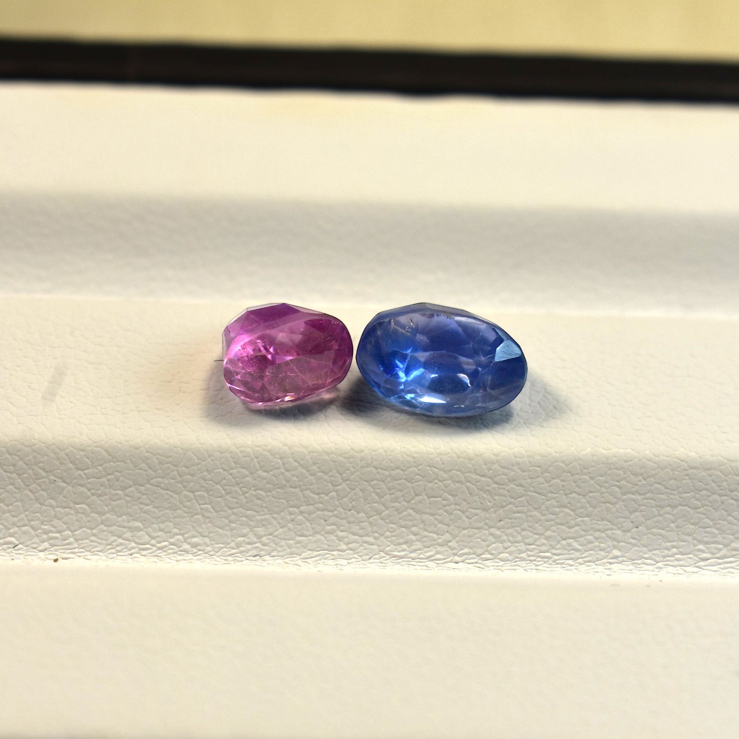 other Side profile view of the unheated 5 carats total Sri Lankan old cut sapphires highlighting their authentic antique proportions and unique pavilion depths.