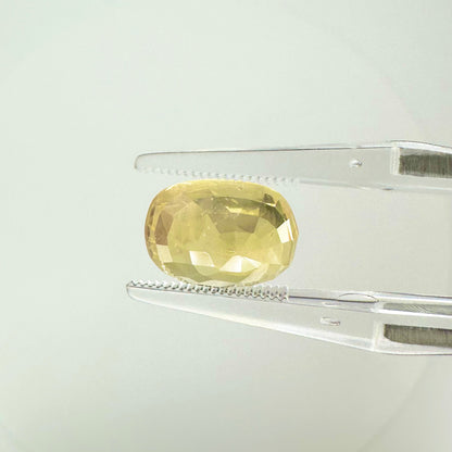 Side profile view of the unheated 6.10 carat Sri Lankan yellow sapphire highlighting its excellent symmetry and deep pavilion depth.
