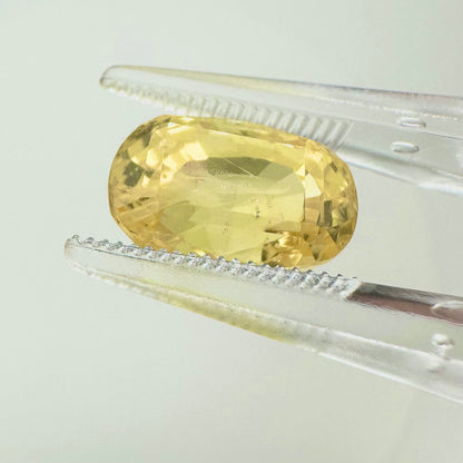 Side profile view of the unheated 6.10 carat Sri Lankan yellow sapphire highlighting its excellent symmetry and deep pavilion depth.