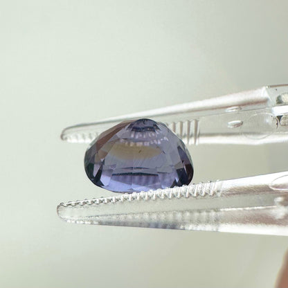 Side profile view of the unheated 2.70 carat Vietnam lavender spinel highlighting its perfect symmetry and pavilion depth.