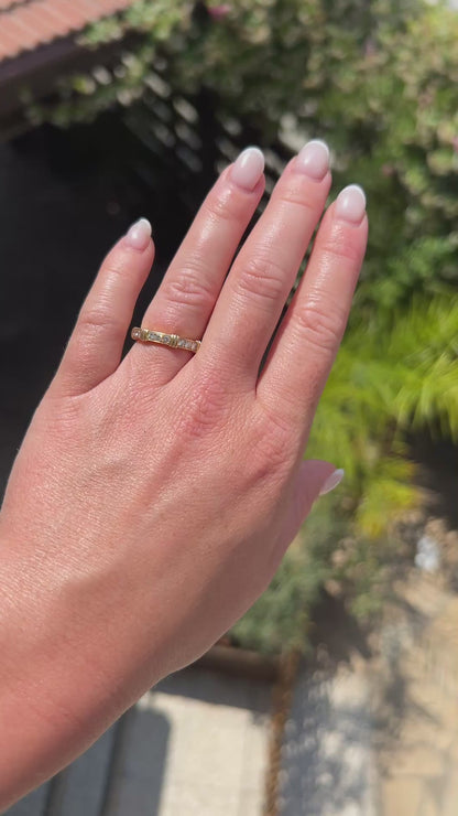 High-definition video capturing the iconic, structured lines of the 18k yellow gold Cartier Contessa ring, the intense fiery brilliance of the 0.9-carat pavé diamonds, and the authentic engraved signature and serial number on the polished gold surface in motion.