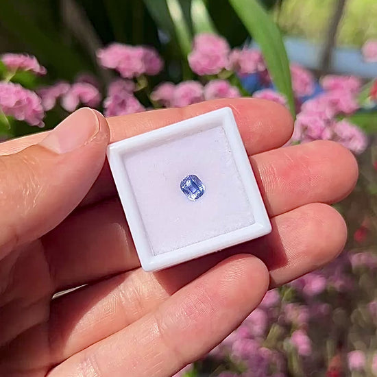 Video showing the sophisticated hall-of-mirror reflections, vivid blue flashes, and elegant luster of the unheated 0.89ct Ceylon emerald cut sapphire in motion.