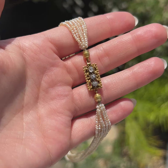 High-definition video capturing the lustrous glow of the multi-strand pearls and the fiery brilliance of the antique old-cut diamonds on the 18k gold Belle Époque choker necklace clasp in motion.
