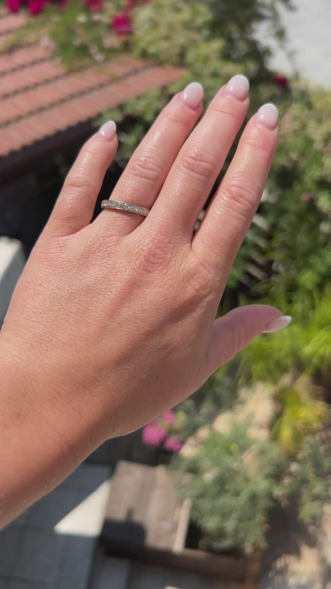 High-definition video capturing the continuous flash, seamless 360-degree fiery sparkle, and geometric engraved detailing of the 2.00-carat antique Art Deco diamond eternity band in motion.